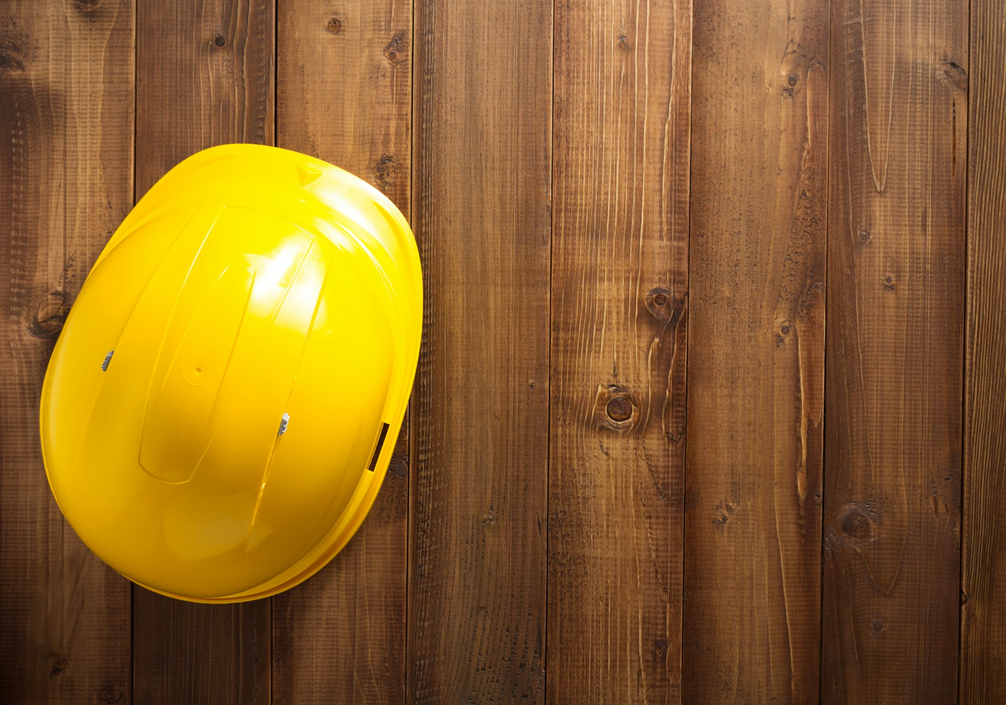 construction helmet hard hat on wood