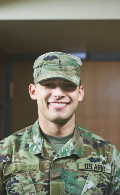 Shot of a young soldier standing in the dorms of a military academy